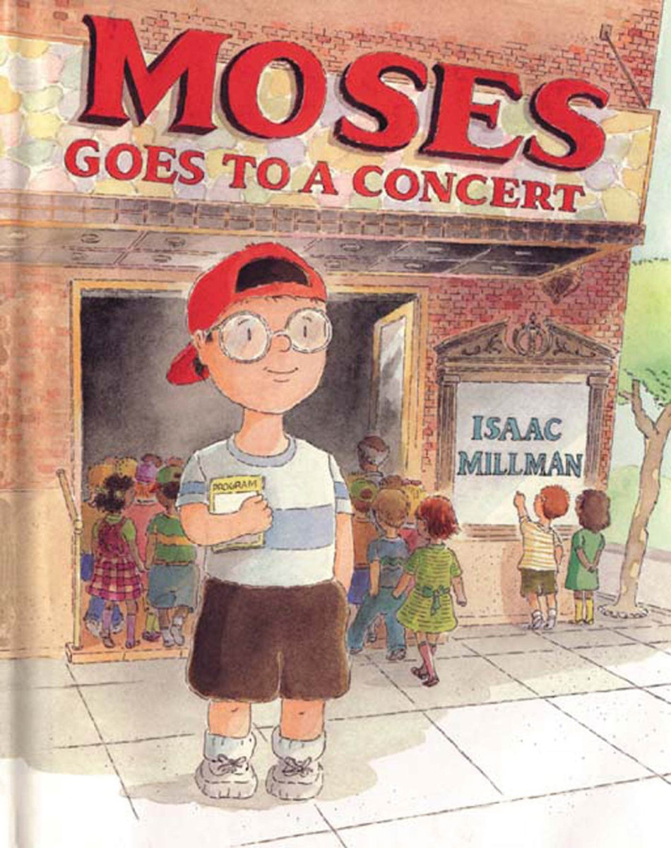 Moses Goes to a Concert book cover. Features Moses, a young boy with white skin wears a red hat, worn backwards, a white t-shirt with one large grey stripe, brown shorts, and white sneakers. He has big, round framed glasses on. Behind him is a red-bricked concert hall. Children are walking in the open doors.